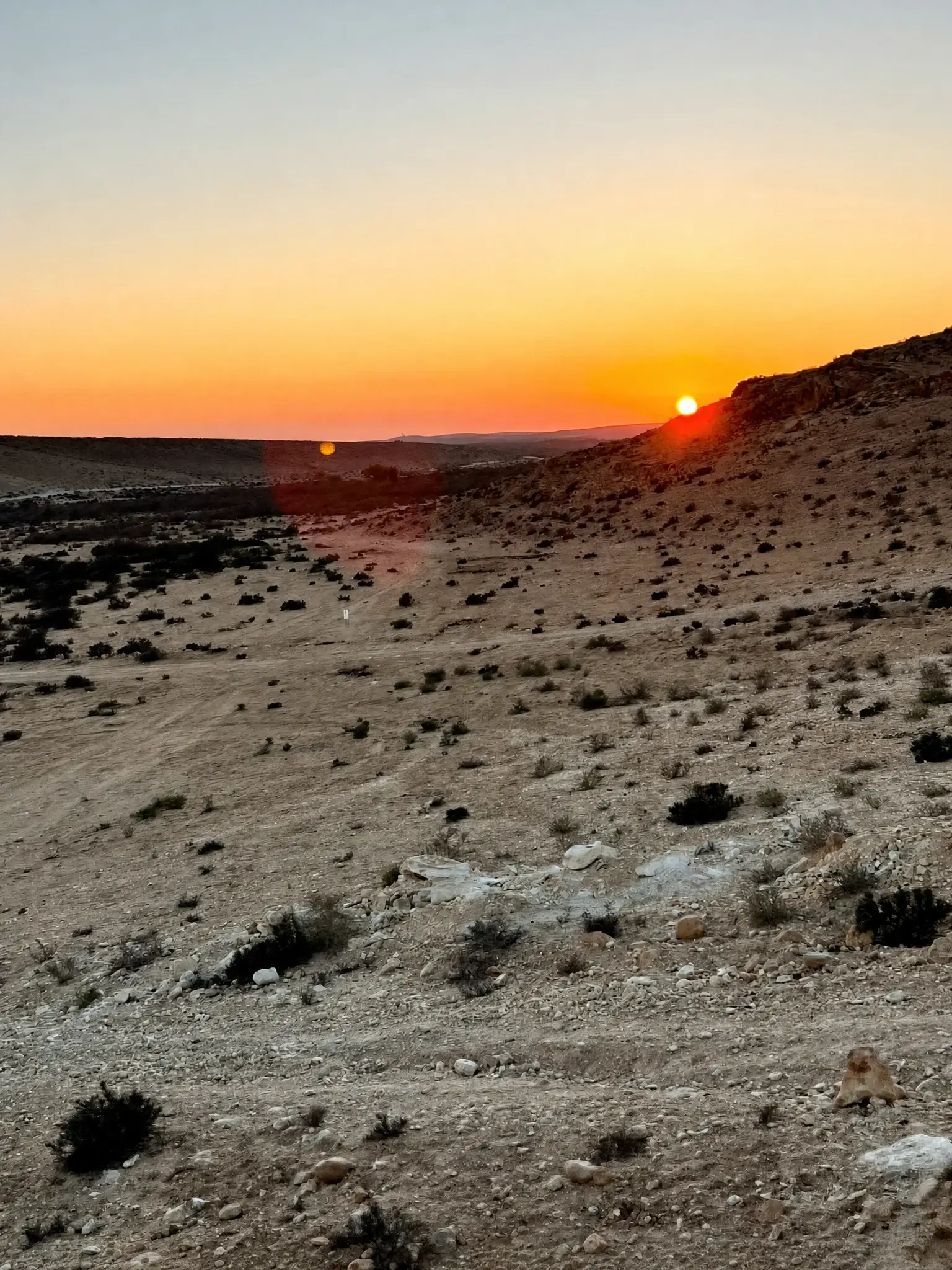 Sunset over the desert hills