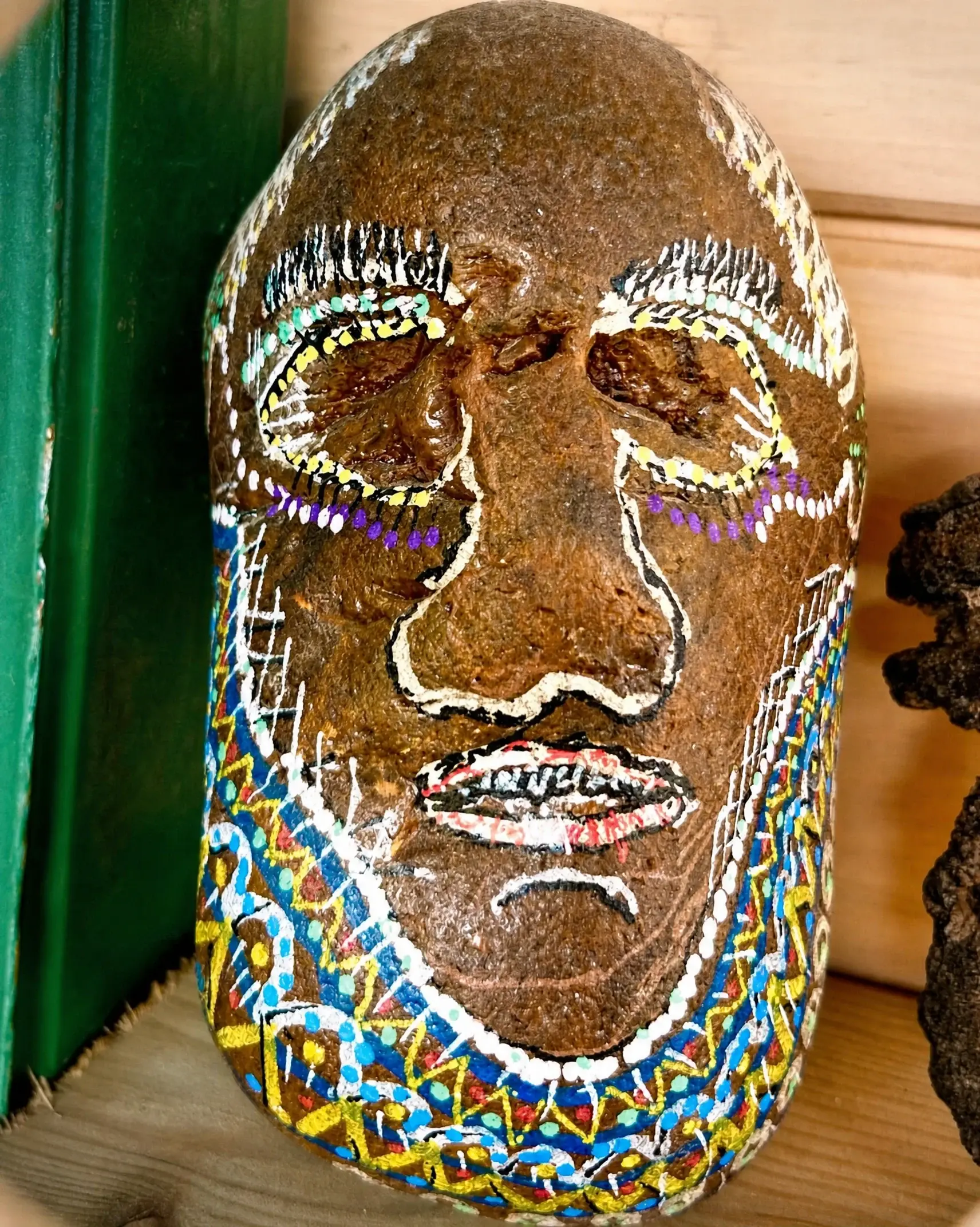 A stone painted as a face