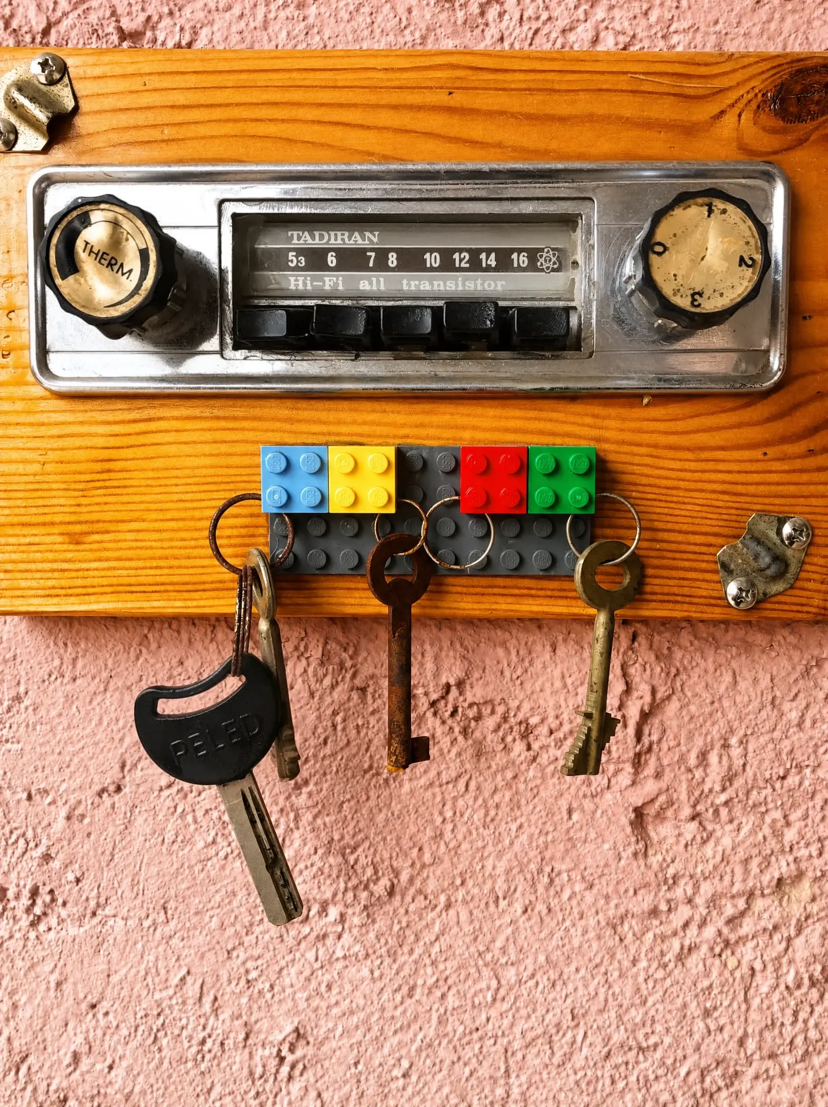 A key rack made from an old car radio and Lego bricks