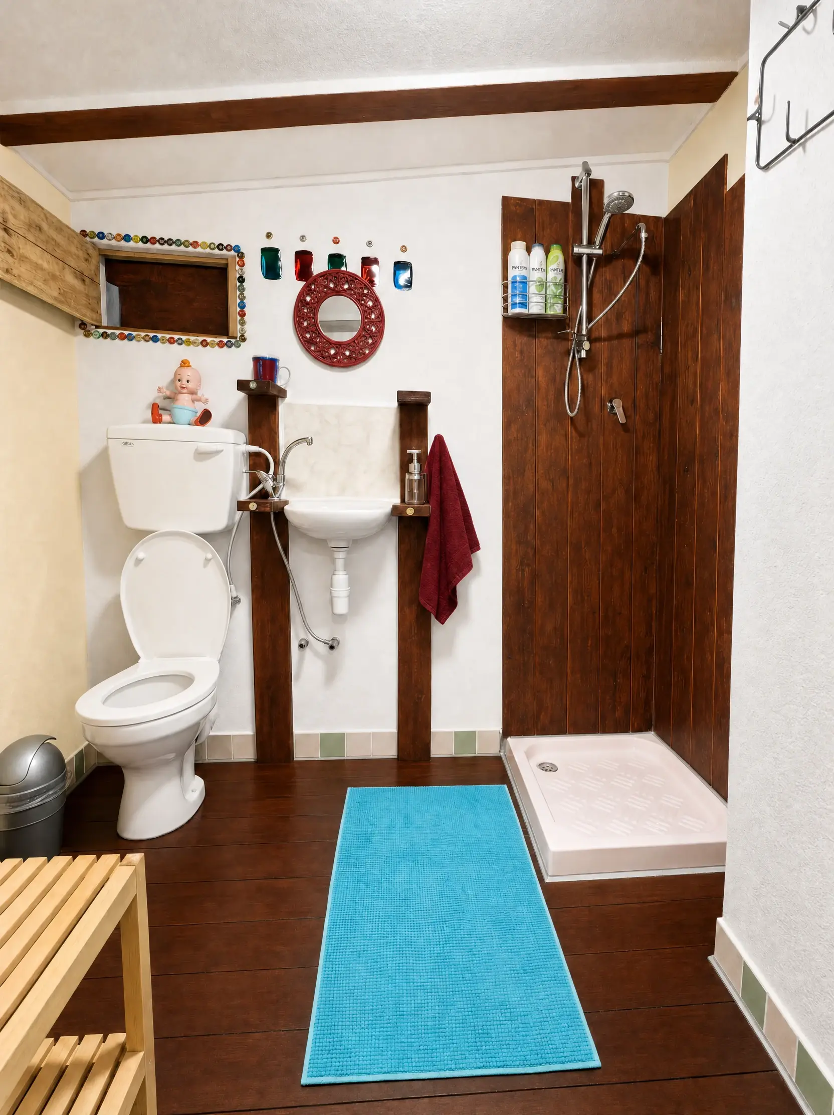 The Eden bathroom: a wood-paneled shower, a small sink and a round red mirror