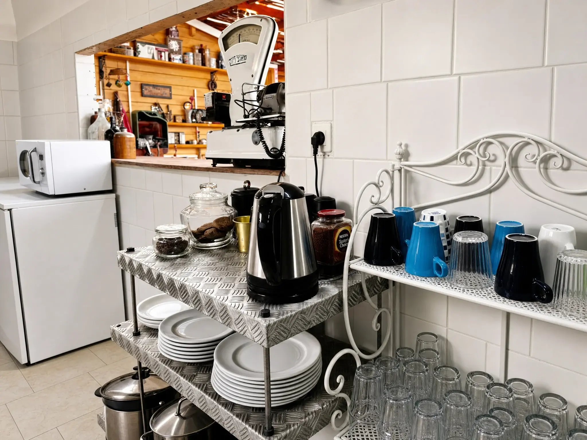 The coffee corner: a kettle, mugs and plates
