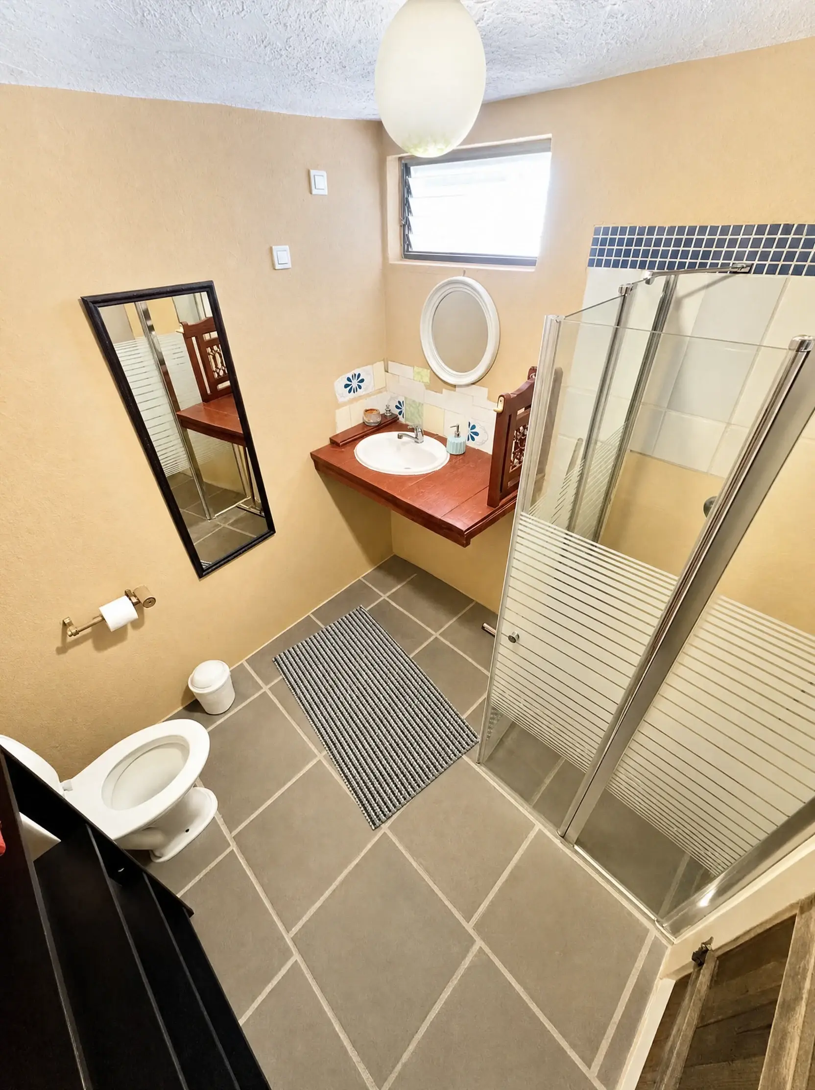 The Maayan bathroom, with a shower and a one-off mirror