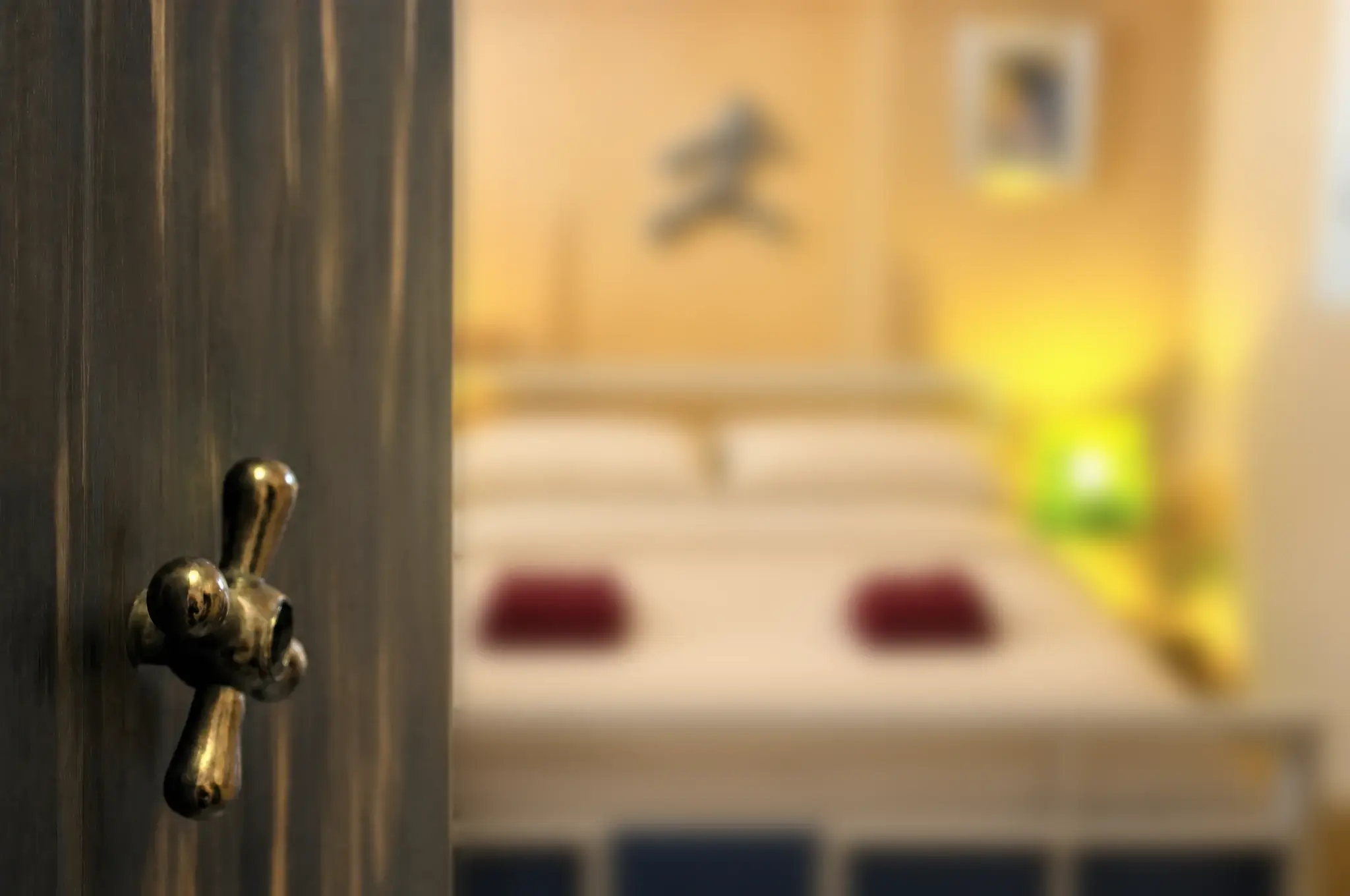 An old door handle, with the Maayan bed beyond