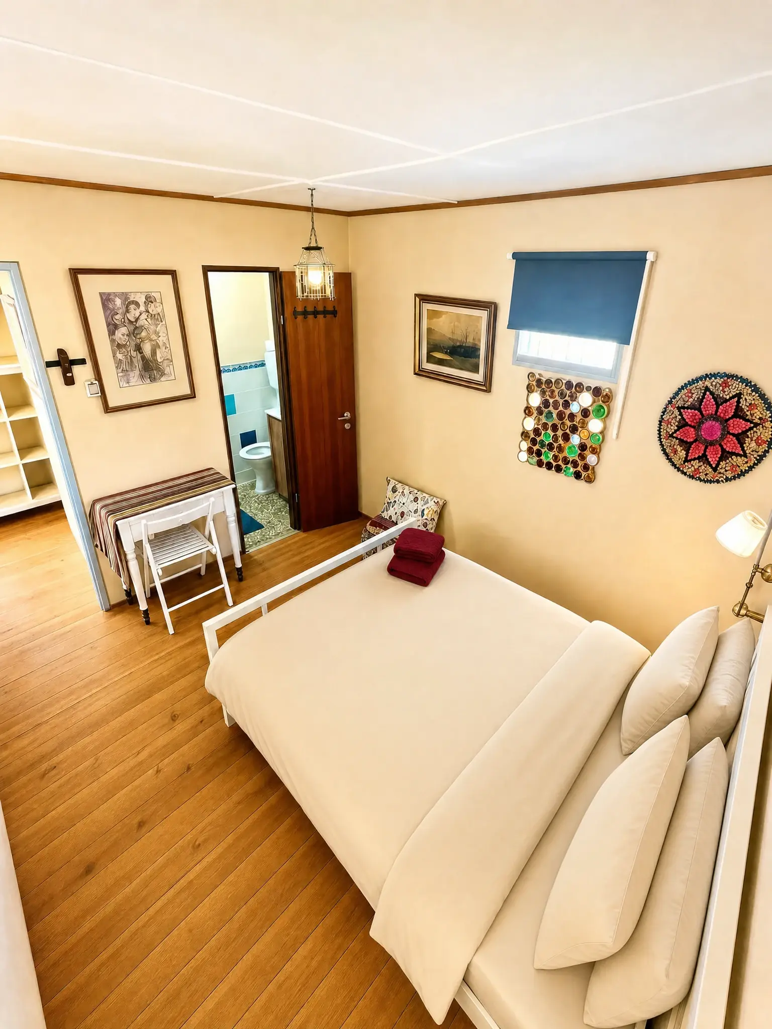 The Muse room: a wooden floor, the double bed and two nightstands